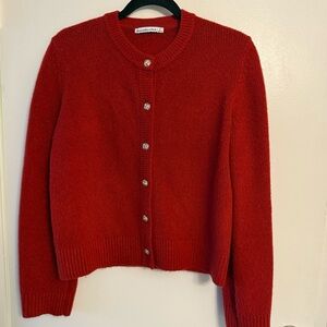 Red cardigan sweater with gold buttons